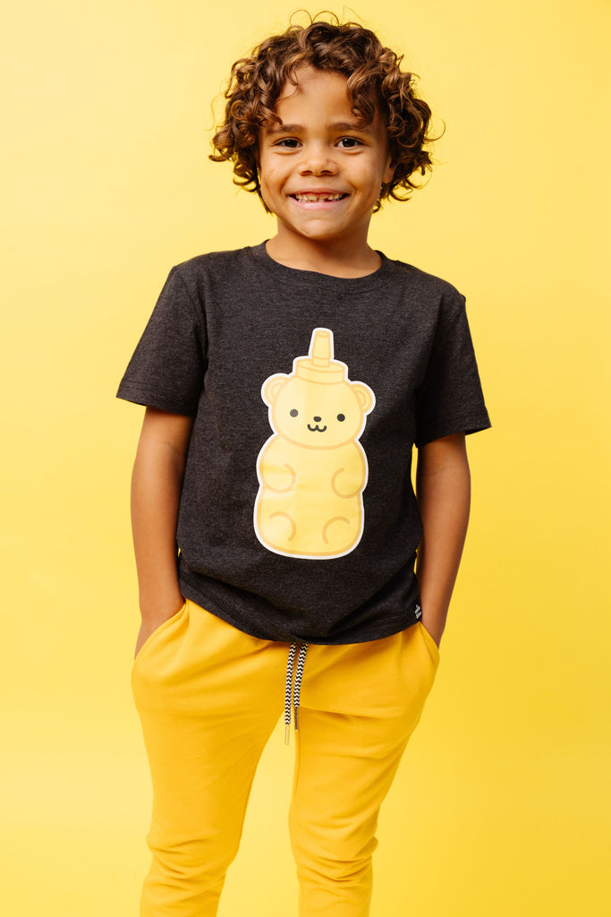 Gender Neutral Kawaii Honey Bear design screen printed in full colour on an organic charcoal heather grey t-shirt. Designed in Poland. Ethically Made. Paired with Best Bamboo Joggers in Yellow. 