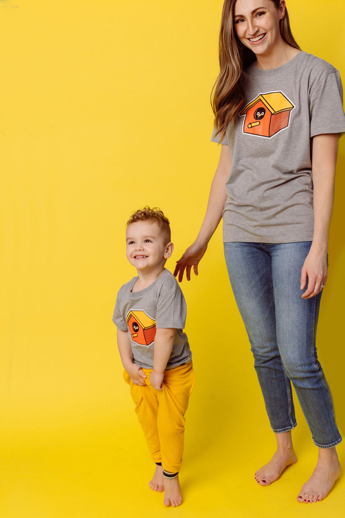 Orange and Yellow birdhouse with peek-a-boo bird eyes and beak screen printed on organic athletic grey t-shirts. Paired with BEST bamboo joggers in yellow. Gender-free and available in kids and adult sizes. Designed in Poland