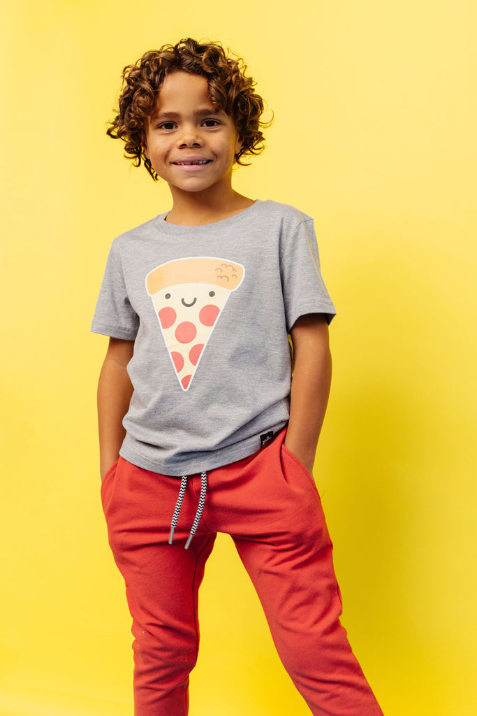 BEST bamboo joggers in red combine the popular features of our two classic jogger styles. Elastic waistband with drawstring, pockets and black and white stripped cuffs. Paired with kawaii pizza t-shirt. Gender Neutral and designed in Poland.