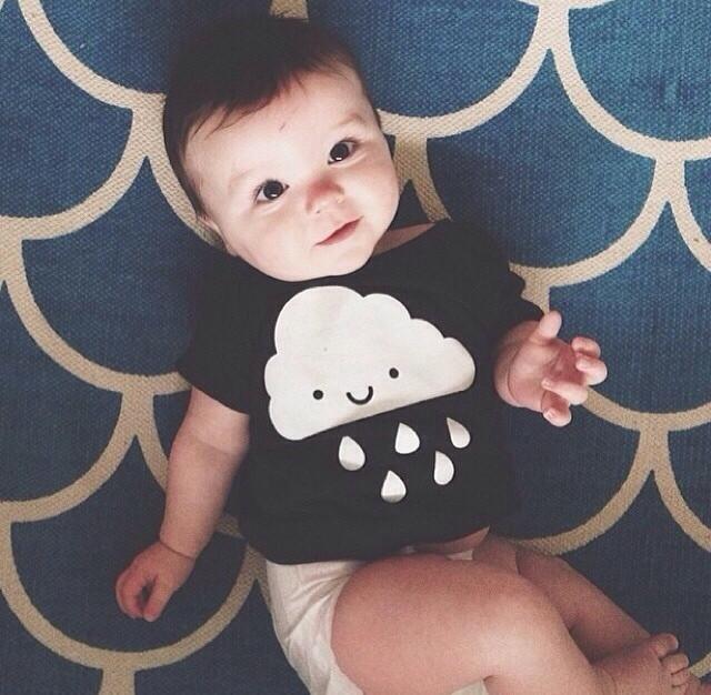 White Kawaii Raincloud design screen printed on an organic charcoal heather grey t-shirt. Available in kids and adult sizes. Gender Neutral and ethically made. Designed in Canada.