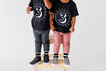 Milestone 3 t-shirt screen printed in white on an organic charcoal heather grey t-shirt. Gender-free.