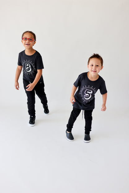 Milestone 5 and 8 t-shirts screen printed in white on an organic charcoal heather grey t-shirt. Gender-free.