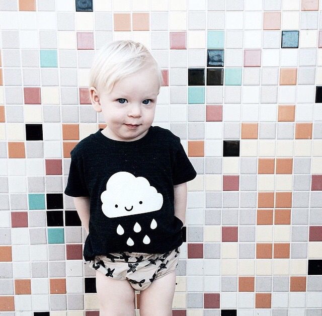 White Kawaii Raincloud design screen printed on an organic charcoal heather grey t-shirt. Available in kids and adult sizes. Gender Neutral and ethically made. Designed in Canada.